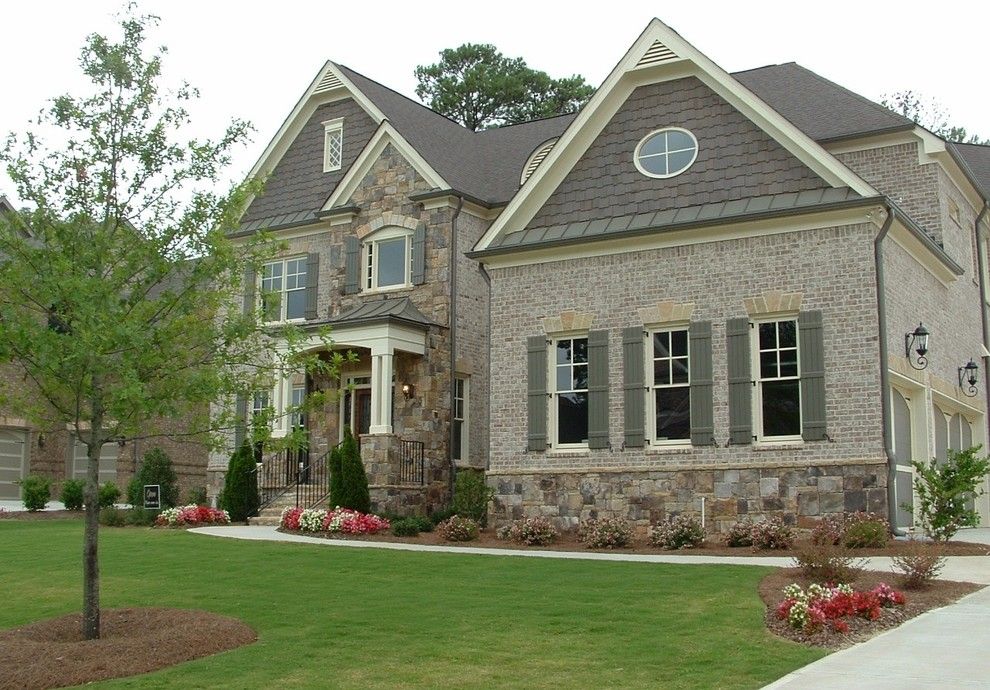 owens corning cultured stone for a traditional exterior with a french influence and chateau at tree lane by dream with jeannie